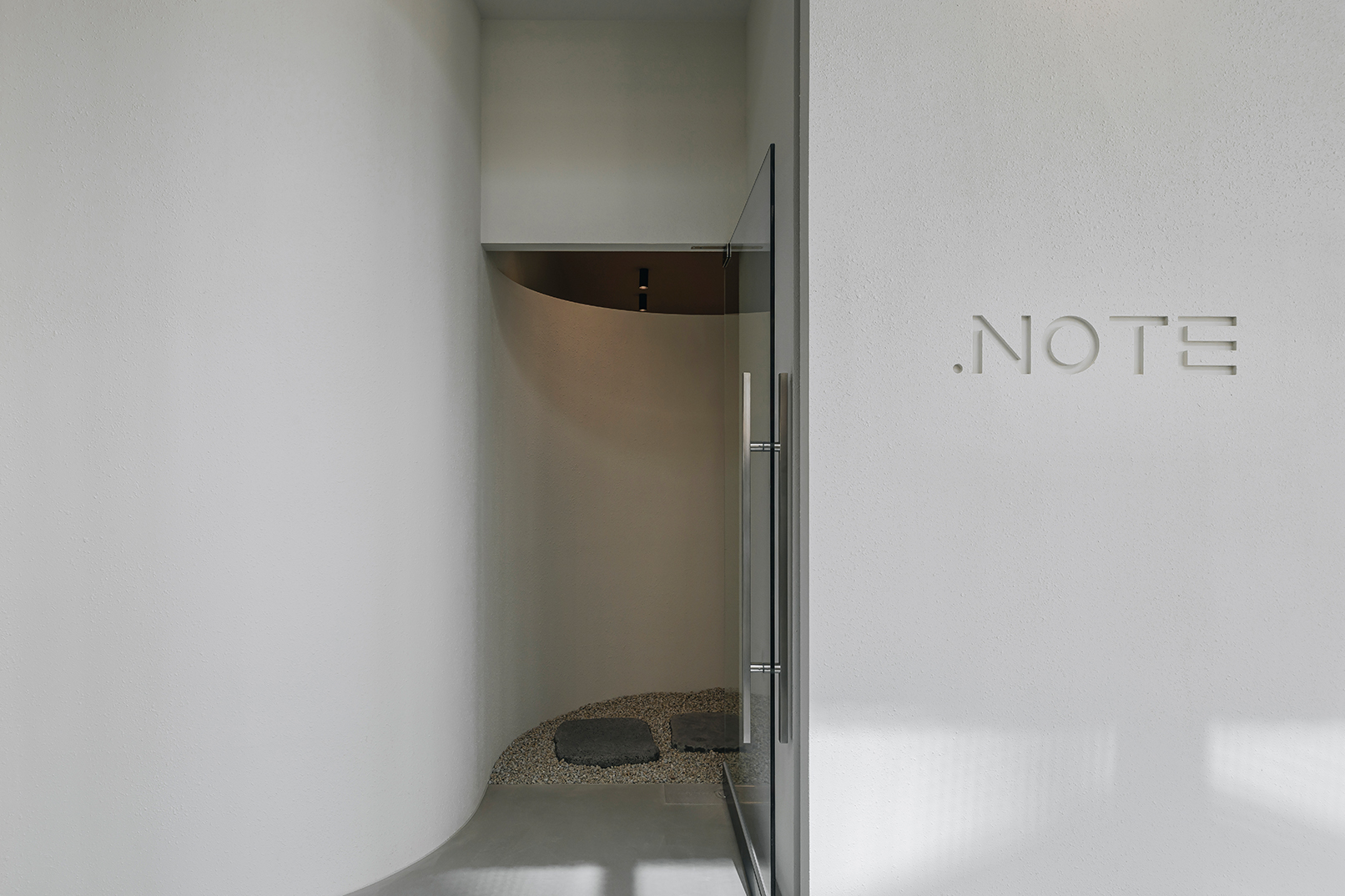 (Entrance) You are greeted by a tranquil stone path at the entrance. It's a space to leave complex thoughts behind and prepare for a healing journey through scent.