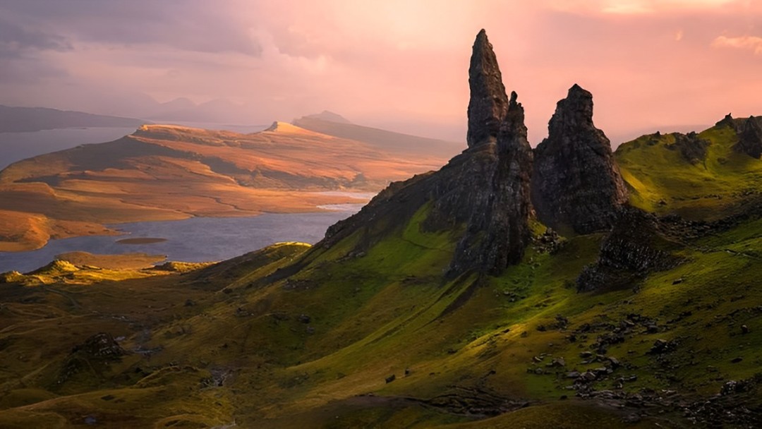 The Old Man of Storr stands tall, bathed in golden light, a mystical Skye landmark