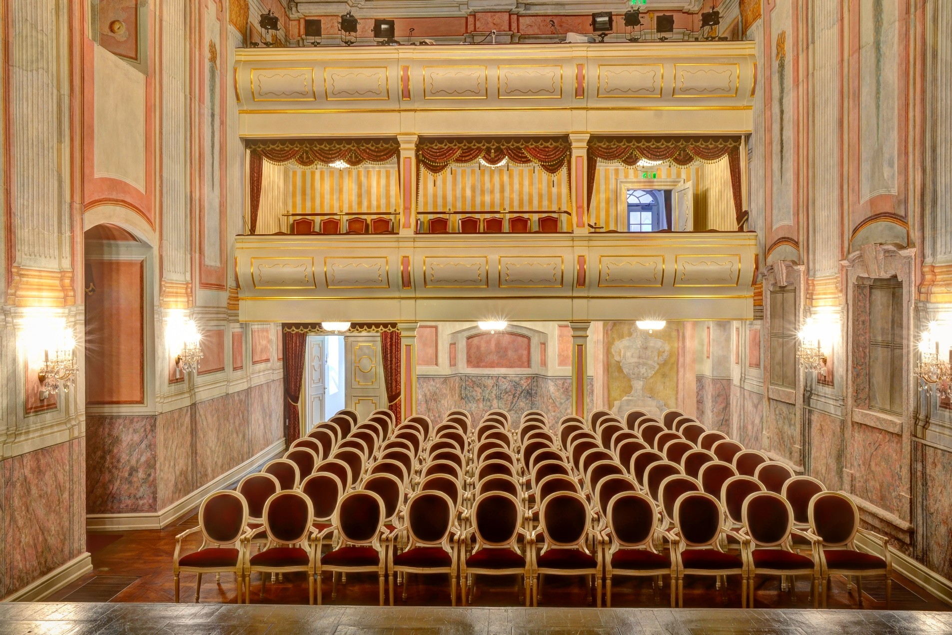 A hall in the Godollo Palace with a lot of chairs
