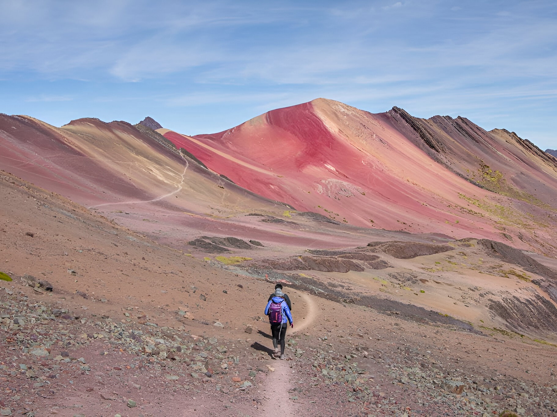 Winding trail leads through dramatic mountain scenery en route to Rainbow Mountain