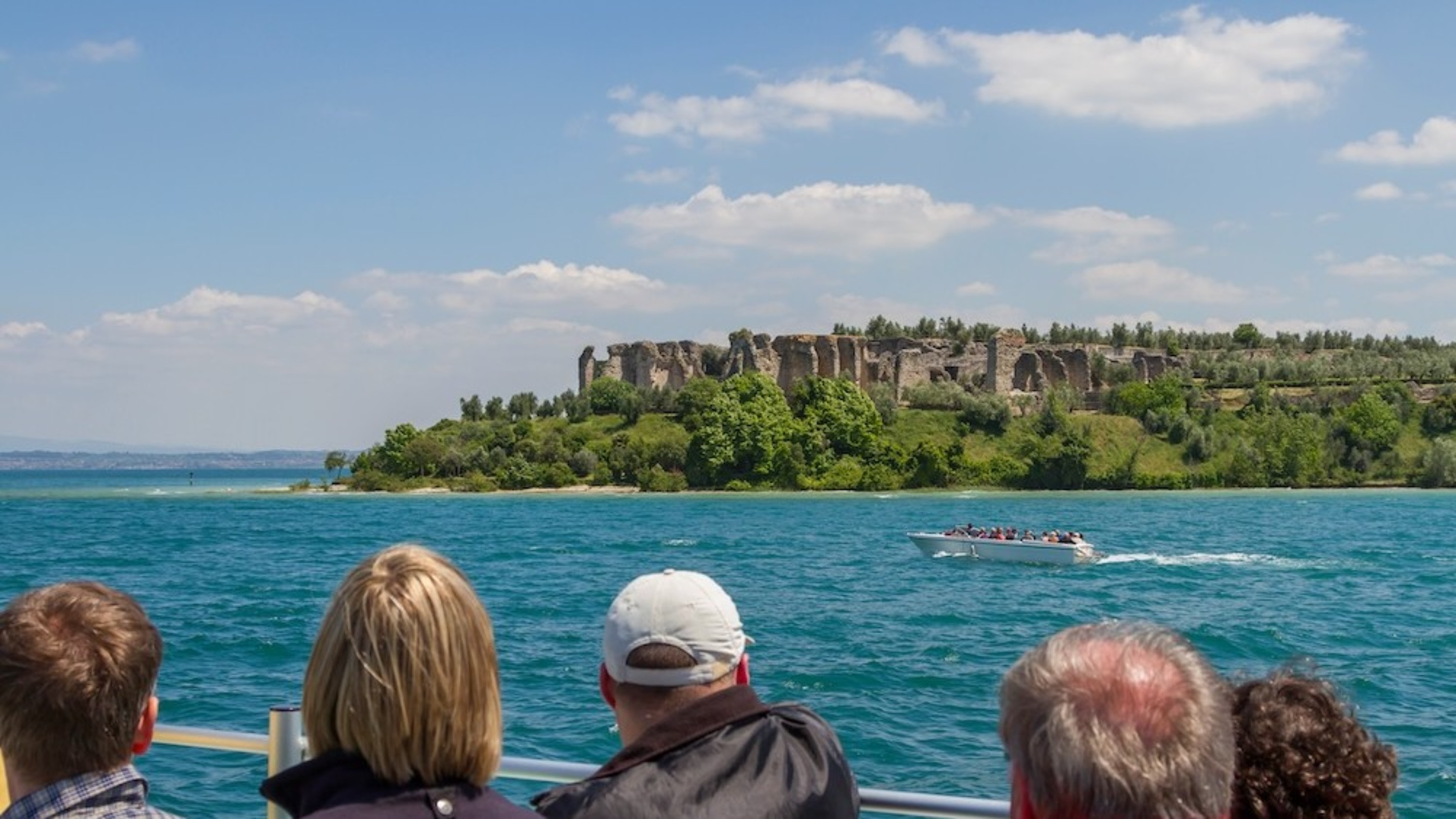 Scenic boat tour on Lake Garda with stunning views of Grotte di Catullo ruins