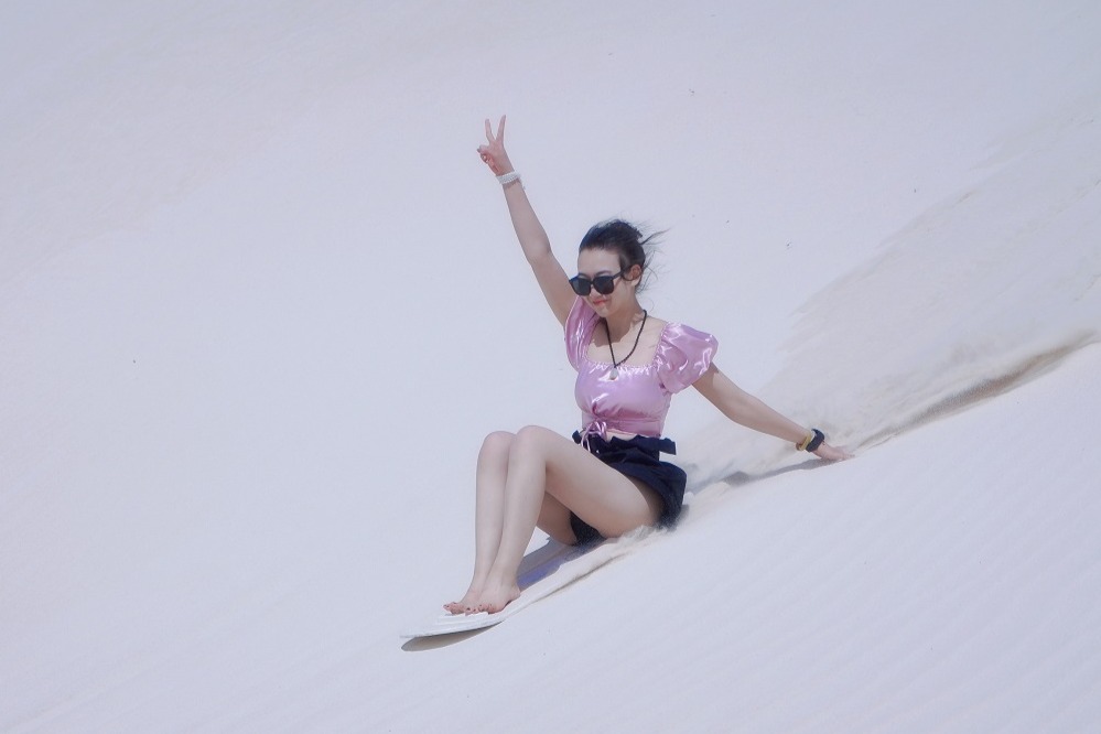 Enjoy the sandboarding activity at the White Sand Dunes