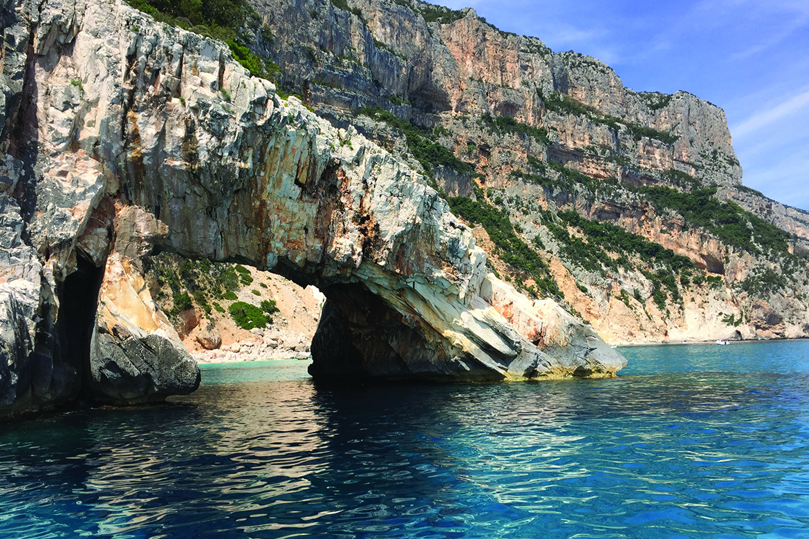 Marvel at the breathtaking coastal landscapes of Cala Gonone during your Open Water Course, where towering cliffs meet the azure sea