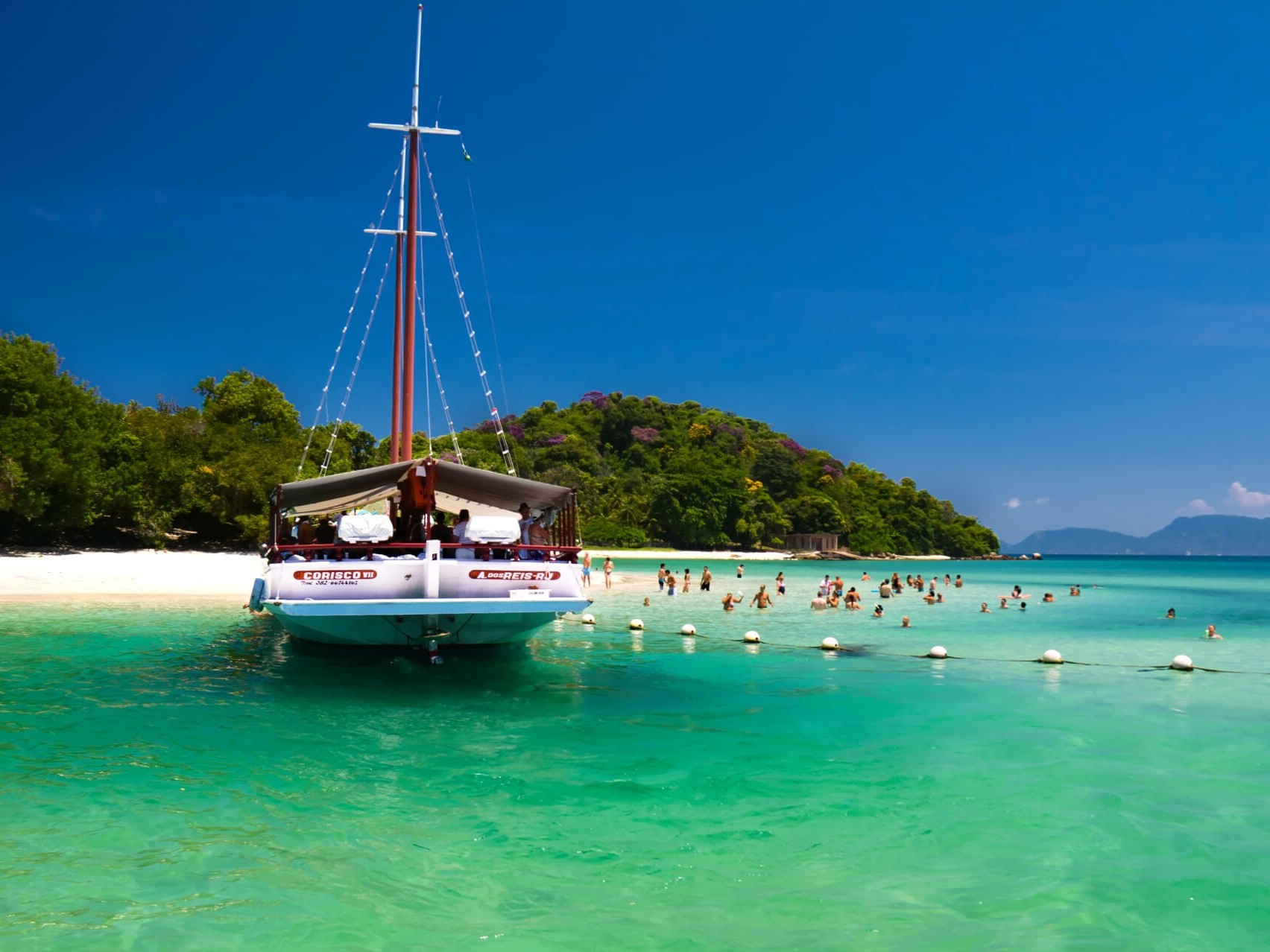 Cruise across turquoise waters and admire the lush landscapes surrounding Ilha Grande island paradise