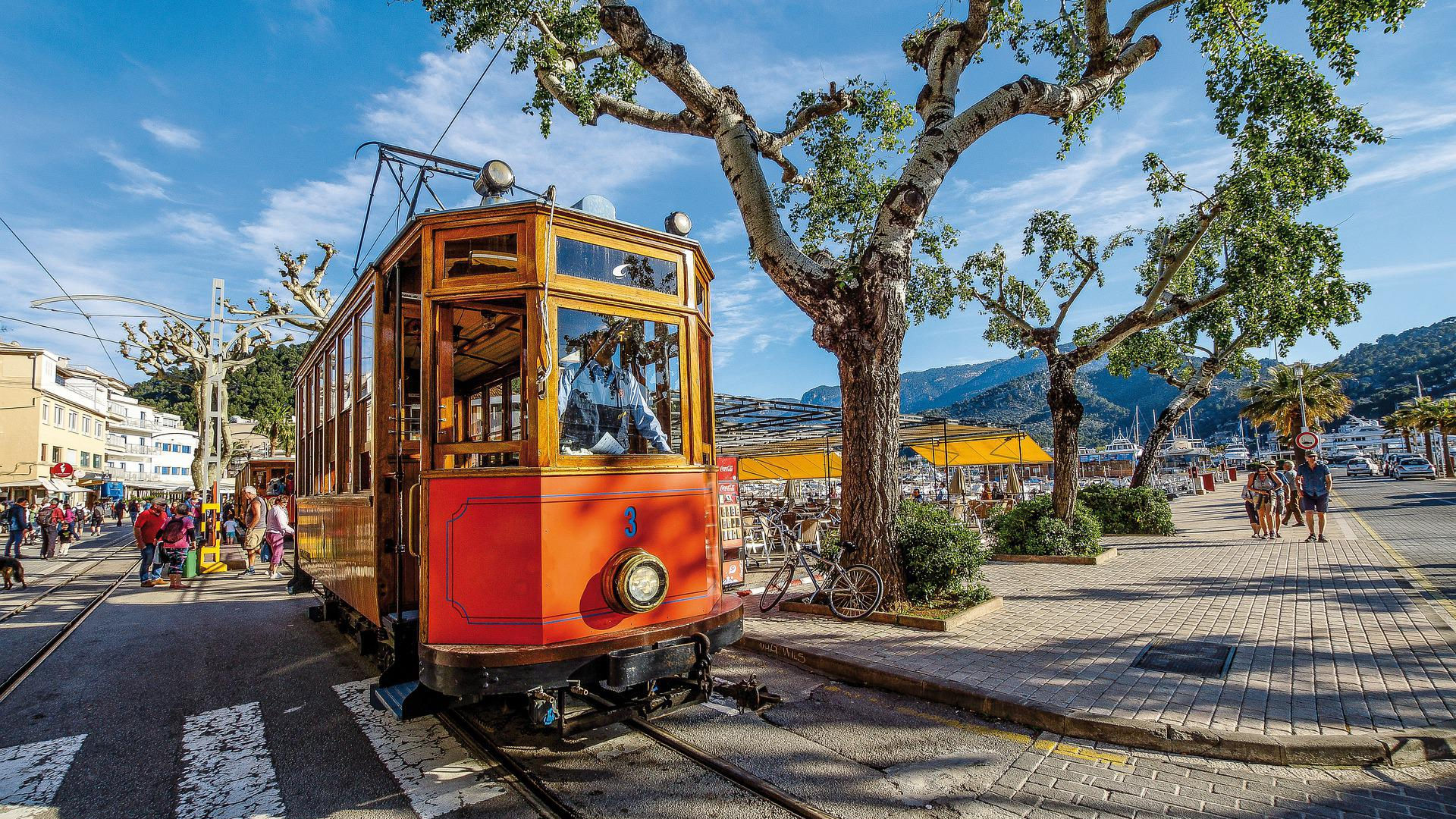 Ride a vintage tram through picturesque towns like Sóller with charming architecture