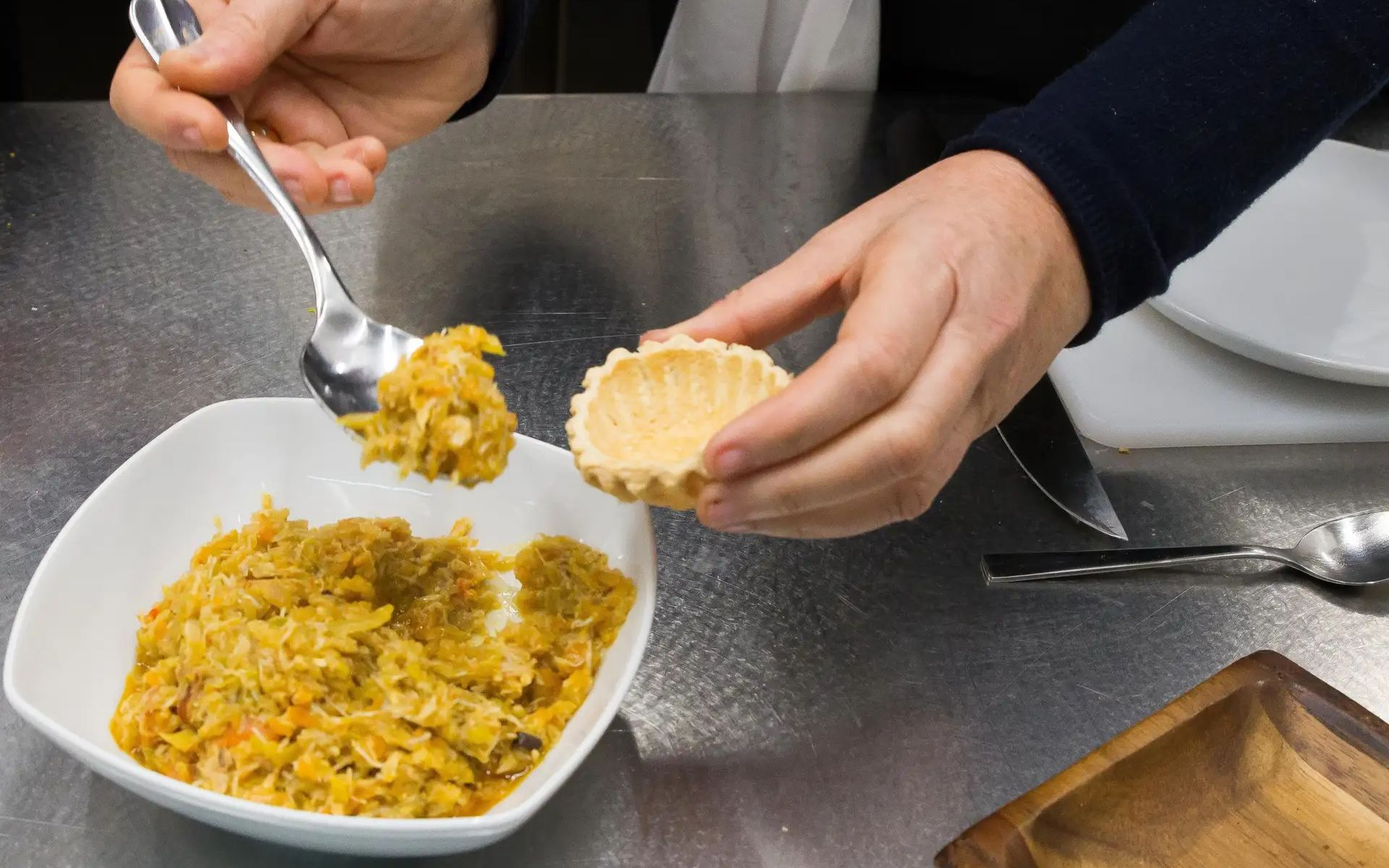 Gain hands-on Basque cooking experience in a traditional kitchen filled with laughter and flavor