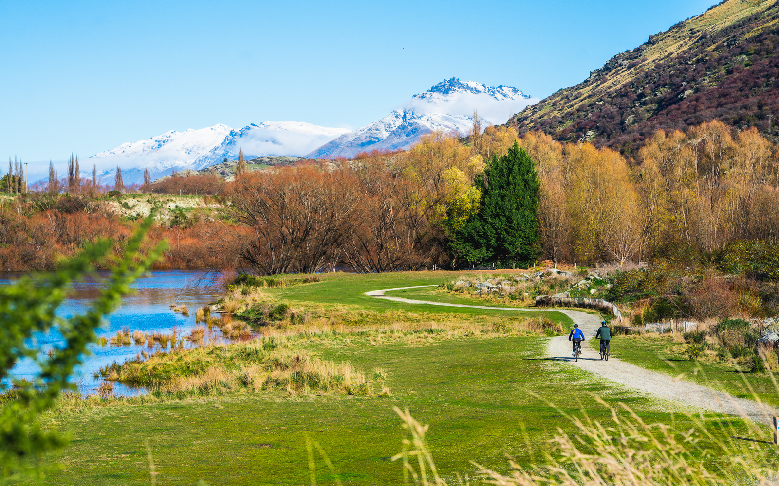 Cycle the scenic Twin River Trail, following winding gravel paths beside sparkling alpine waterways