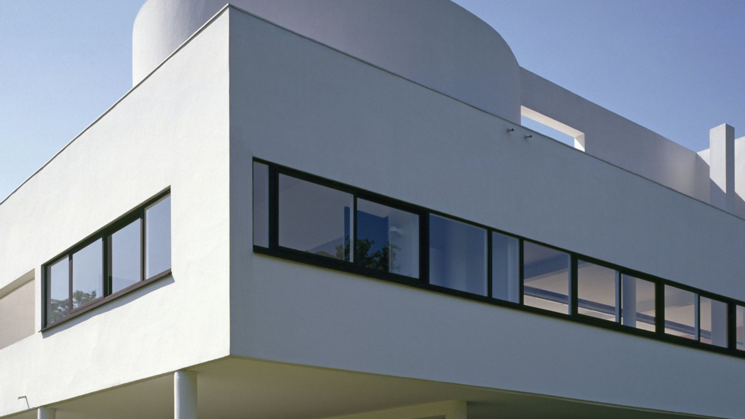 Horizontal windows flood the interior with light, offering panoramic views of the surrounding landscape