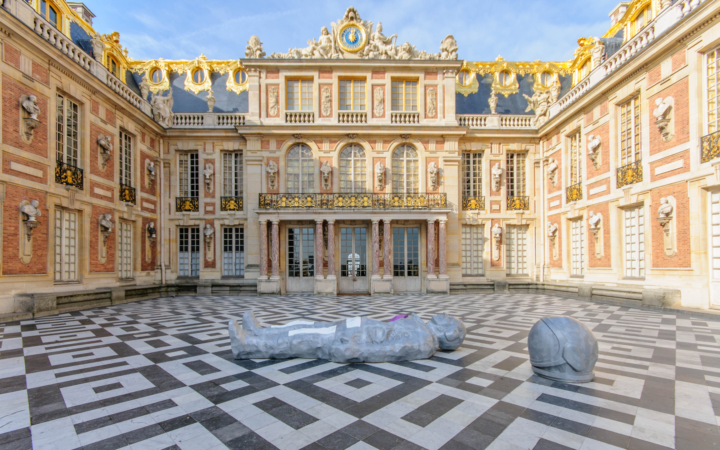Majestic Palace of Versailles courtyard framed by symmetrical classical architecture