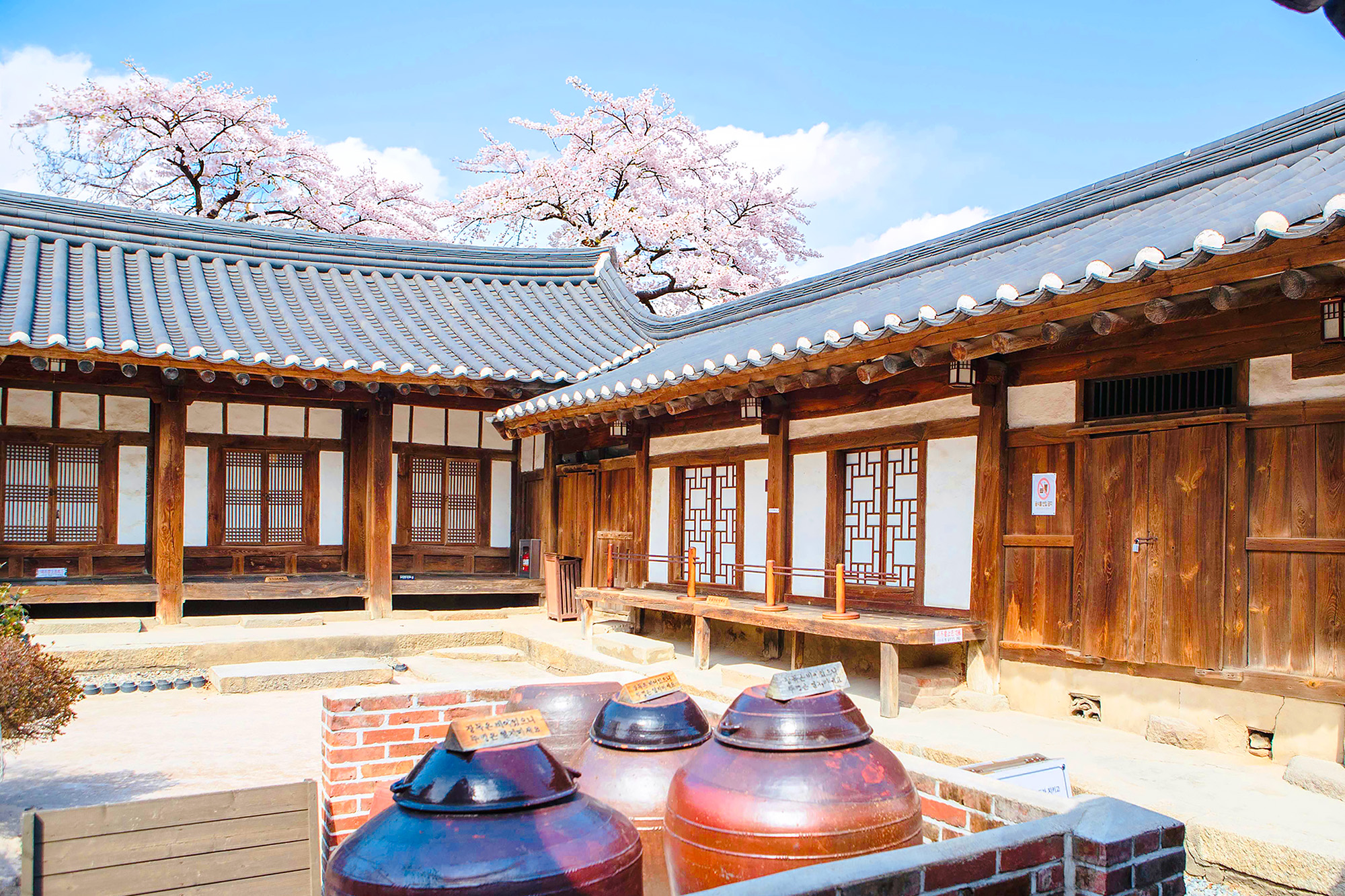 Gyochon Traditional Village is located near key UNESCO World Heritage sites in Gyeongju and offers visitors a glimpse into traditional Korean life through its well-preserved hanok houses and cultural experiences.