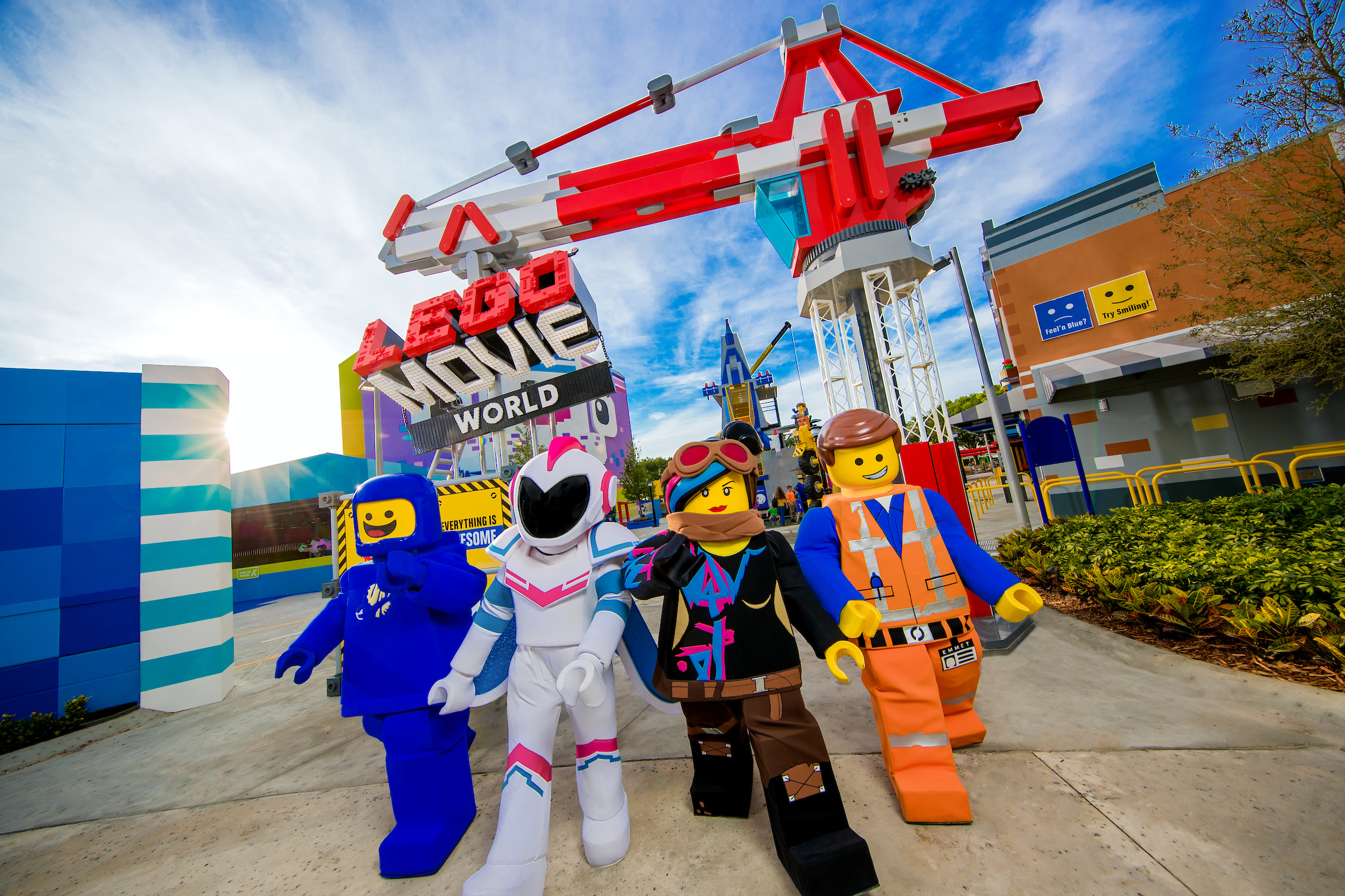 Lego characters are walking from the Movie World area