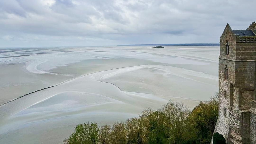 Take in the breathtaking view of the Bay of Mont Saint-Michel, where tides dance