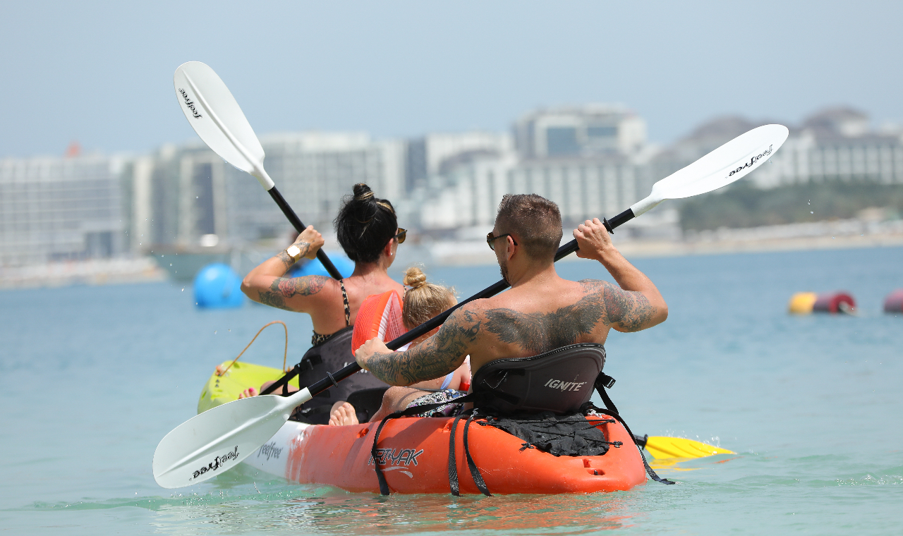 Glide through crystal-clear waters and embrace the calm rhythm of the waves