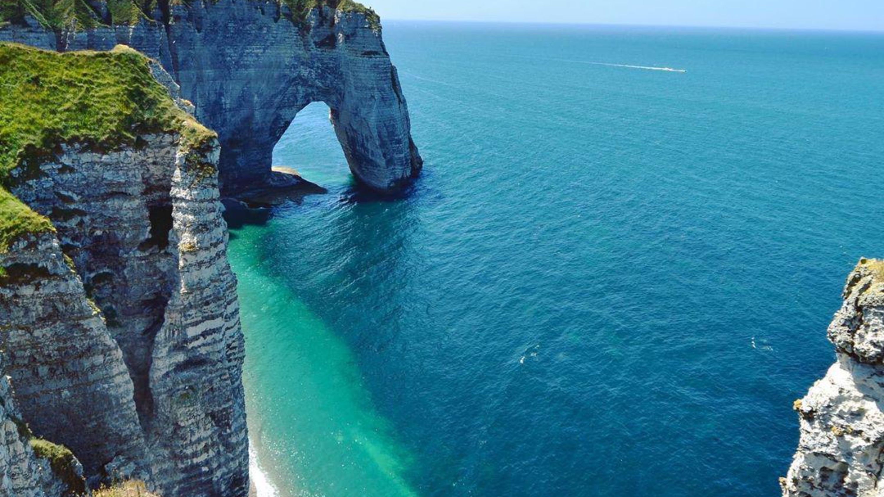 The sea breeze blows gently, and you can hear the whispers of the sea and the rocks.