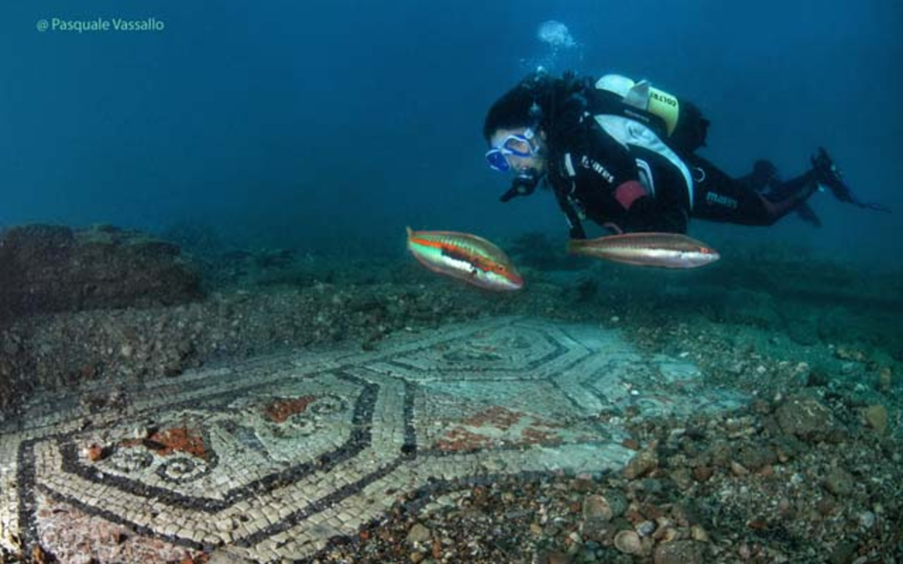 Marveling at ancient mosaic patterns underwater, pure archaeological wonder