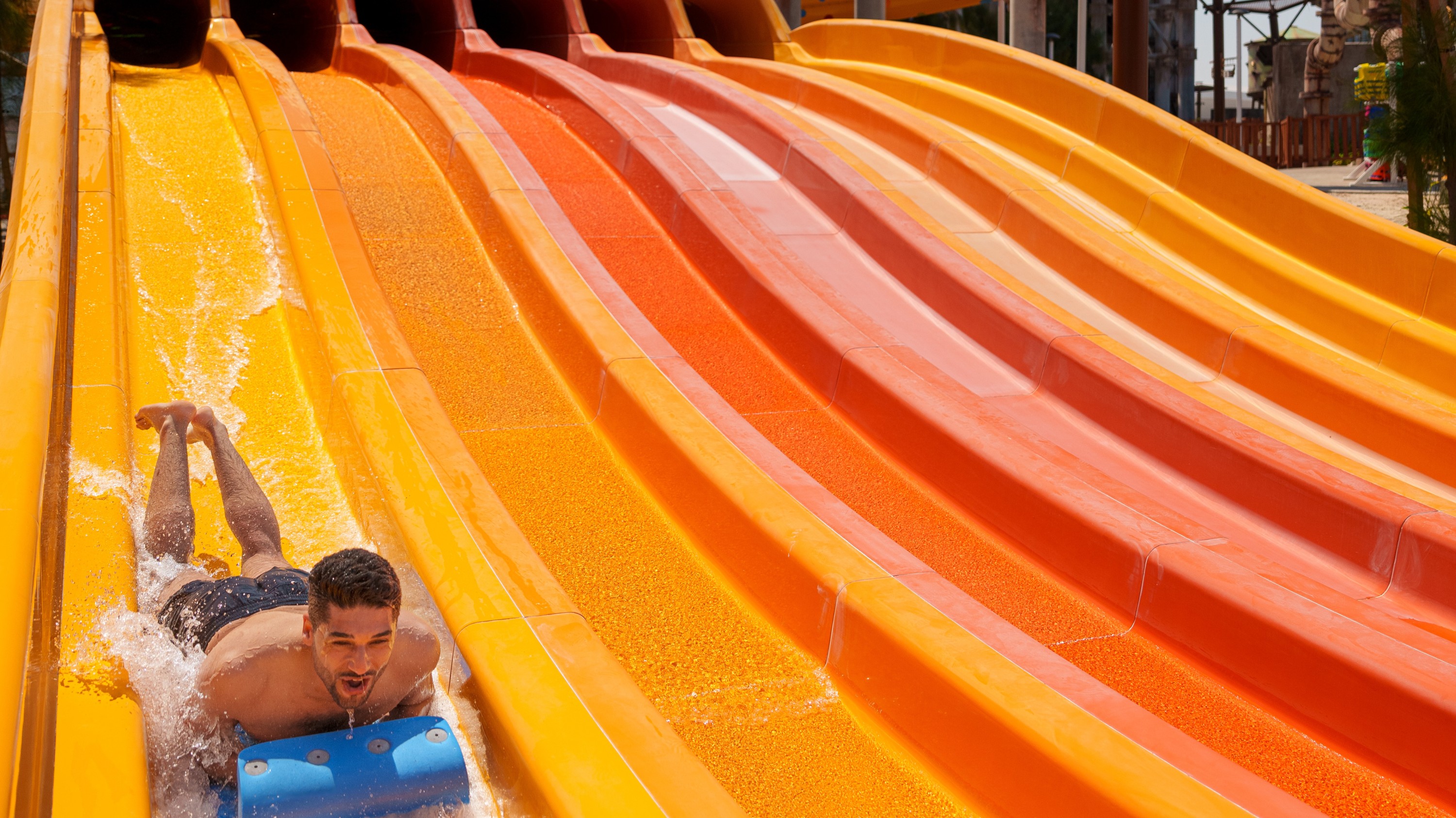 Racing down vibrant water slides at Meryal Waterpark for the ultimate adrenaline rush