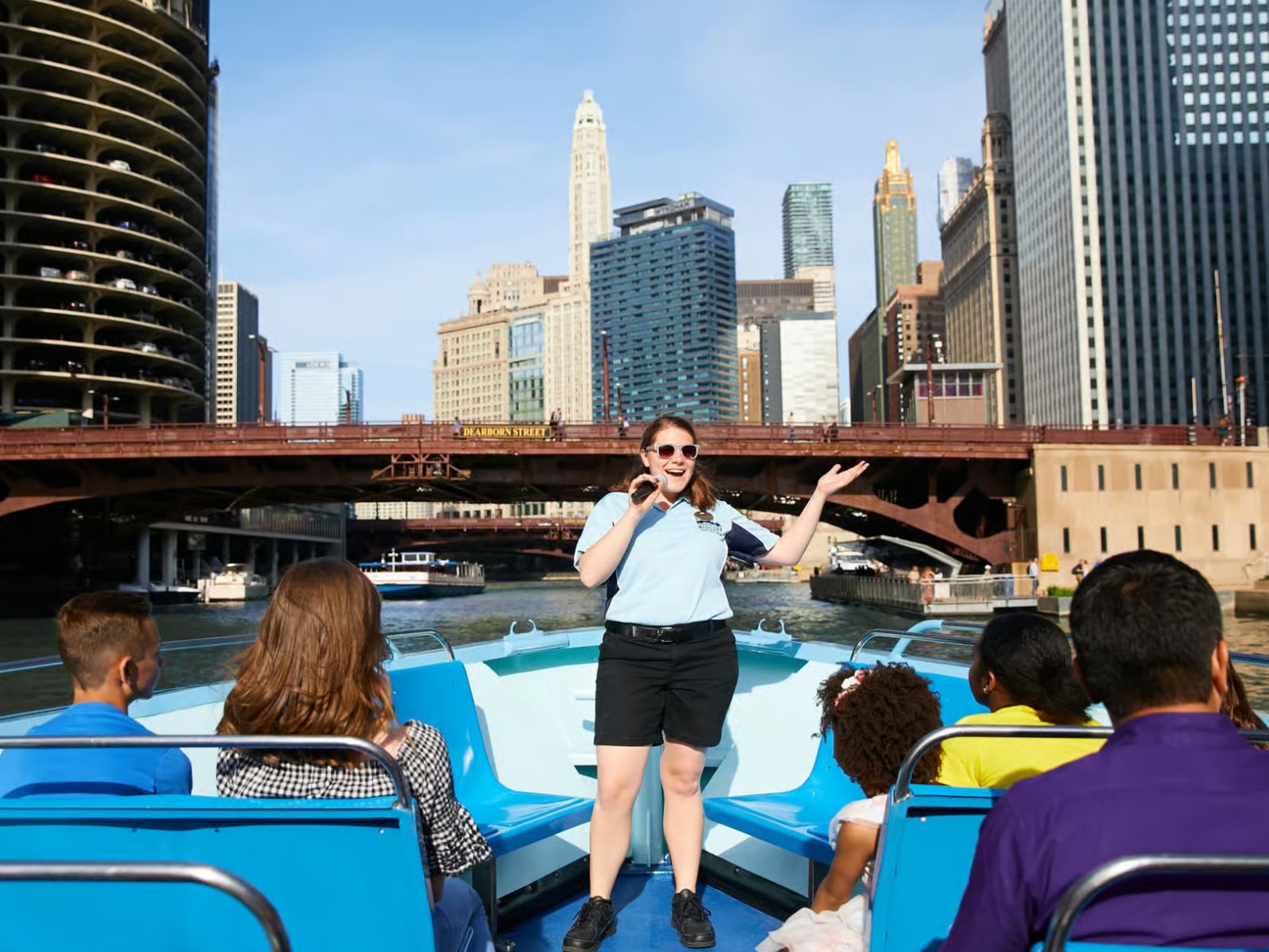 Tour guide engaging passengers with lively stories about Chicago’s history and architectural landmarks