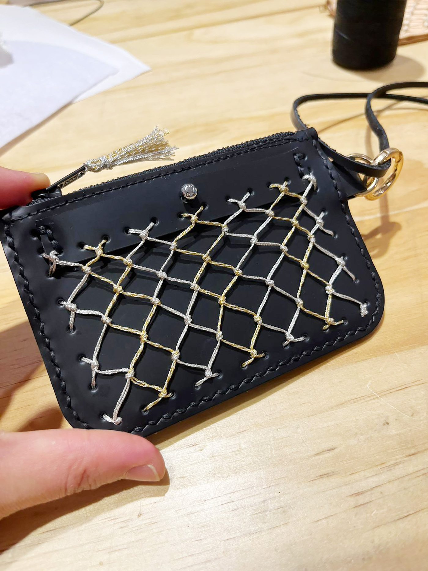 Gold and silver thread with black leather is another color choice