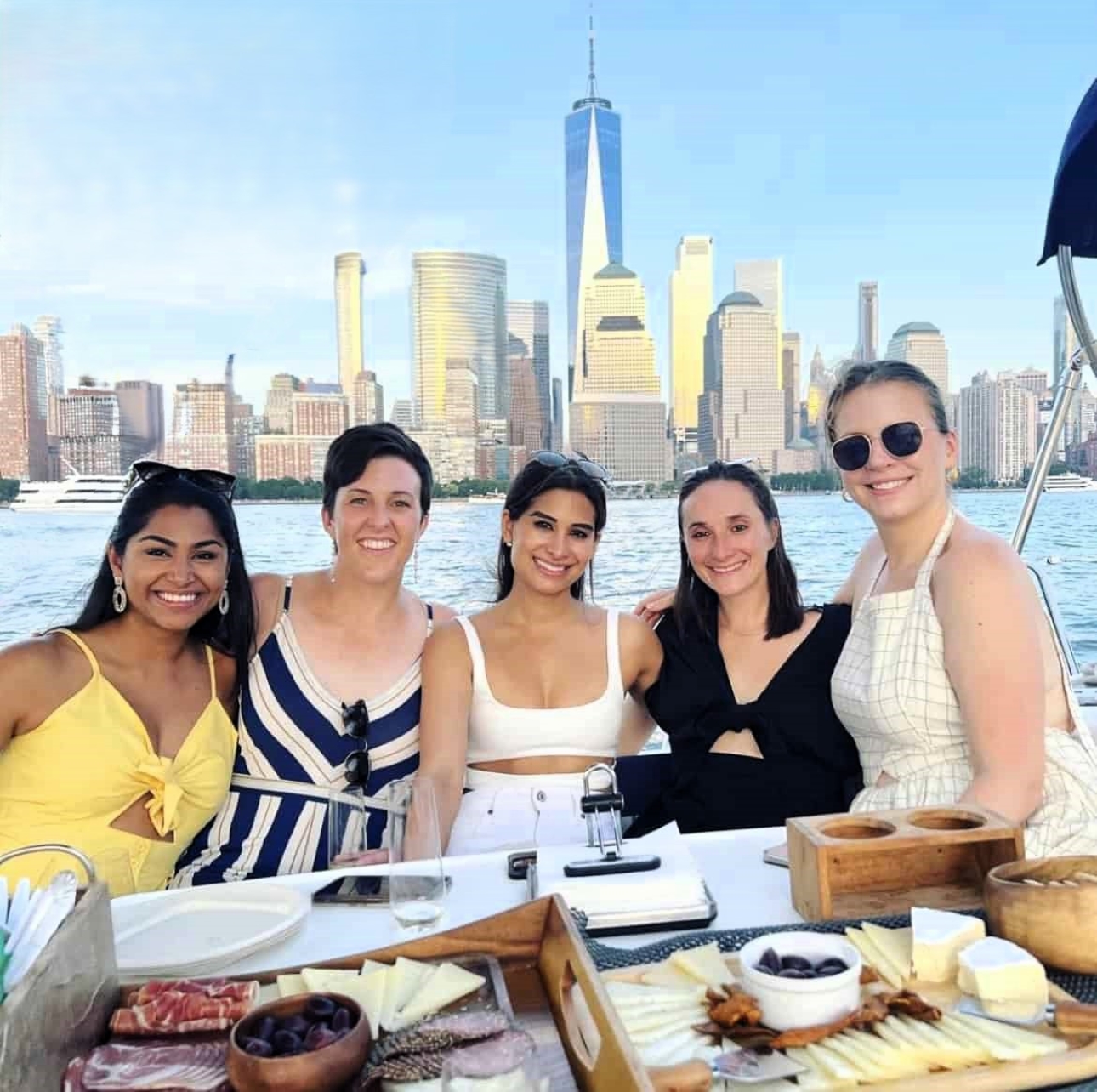 Share an intimate moment with skyline views and a sunset on the water