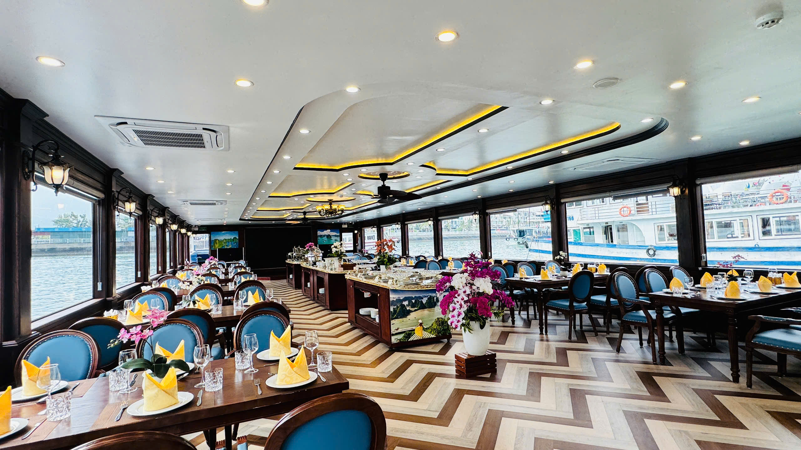 Lunch on authentic Vietnamese specialties with a buffet onboard while enjoying the panoramic ocean view