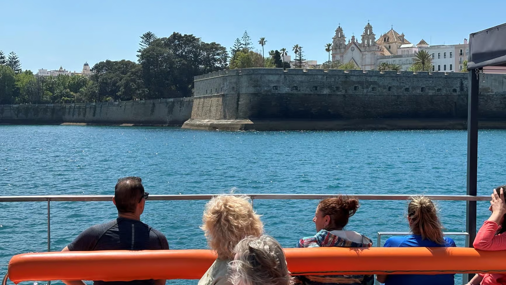 Catamaran sailing smoothly across the bay, offering panoramic views from every seat