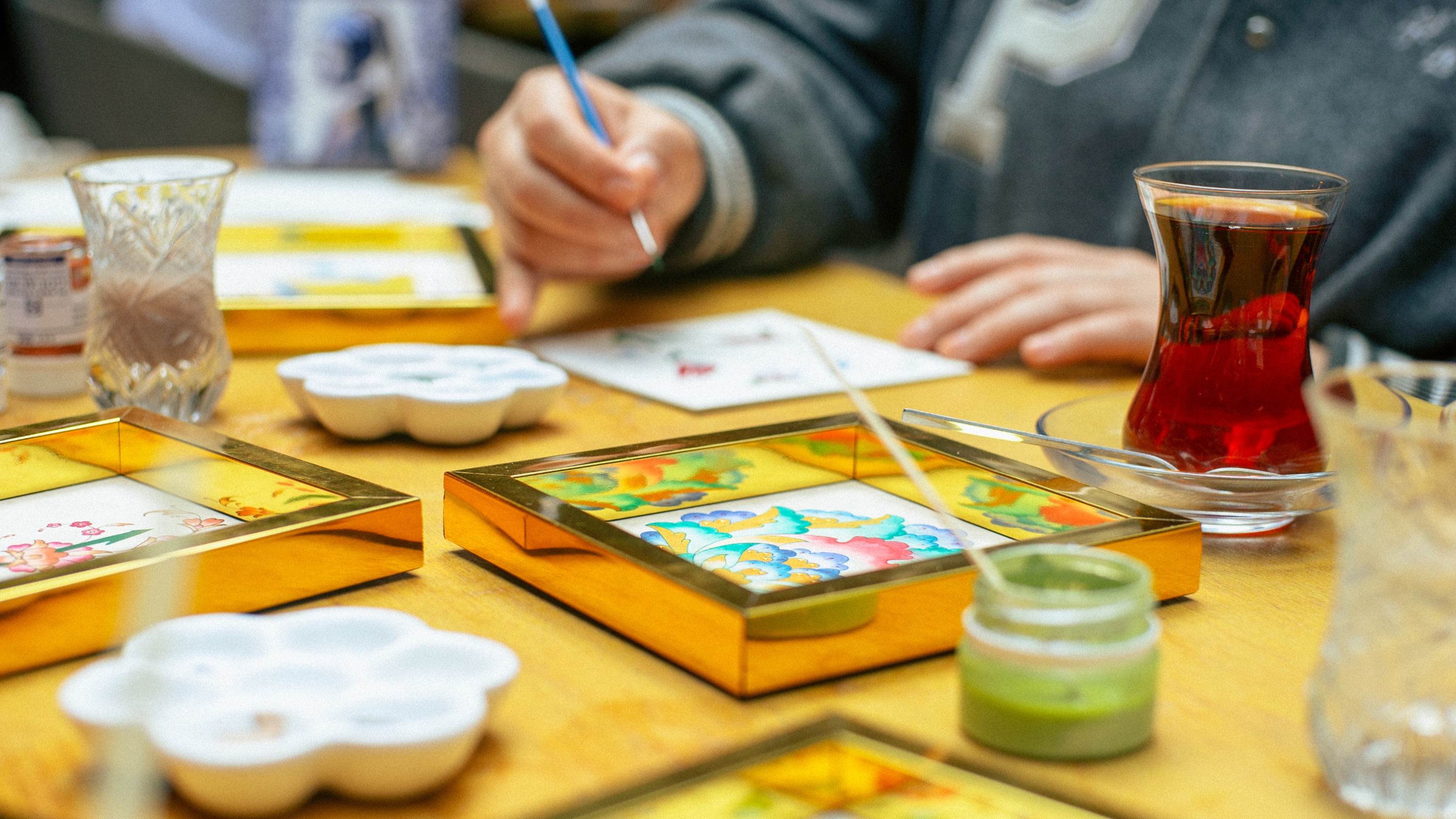 Explore traditional layering techniques, bringing symbolic patterns vividly to life