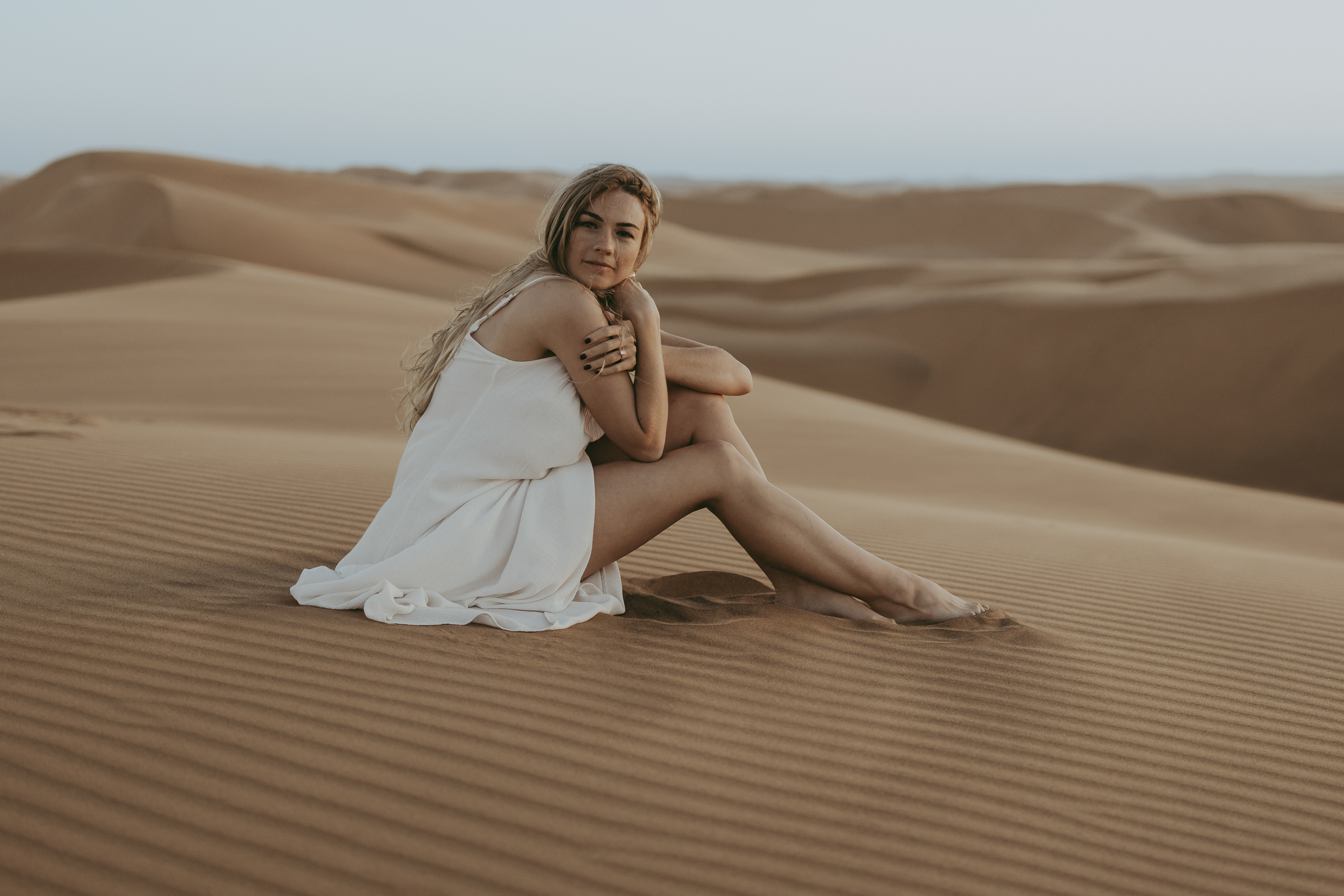 She is enjoying the desert tranquility.