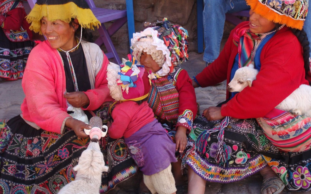 Enjoy Andean artisans displaying their colorful, traditional textiles in lively market surroundings