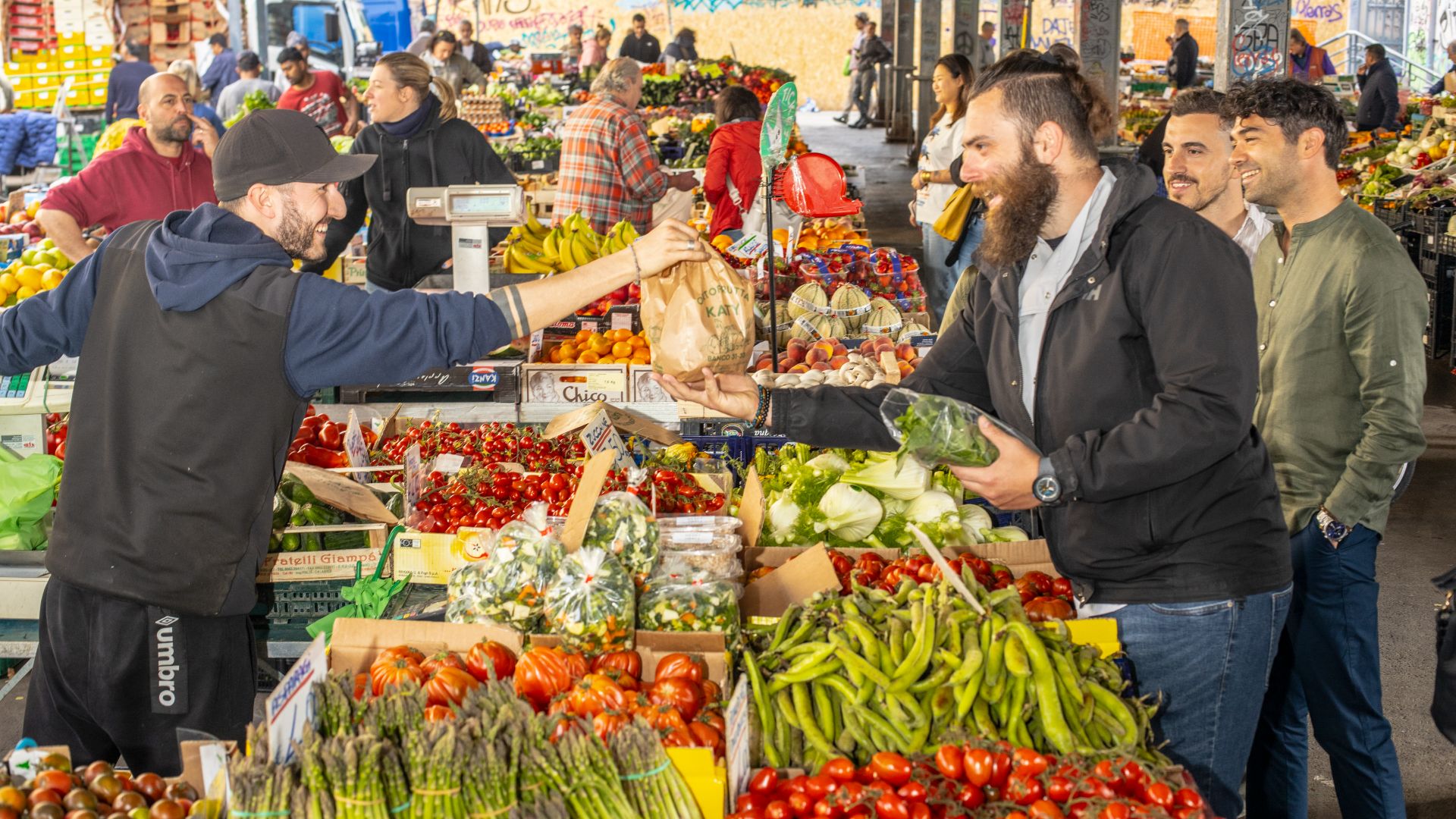Browsing vibrant stalls at Sant’Ambrogio Market, where quality ingredients meet authentic flavors