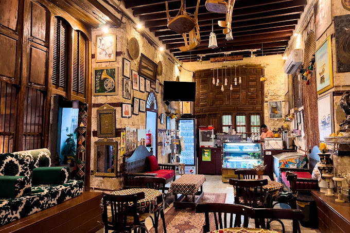 Beyond the historic architecture and bustling alleyways of Jeddah’s historic Al Balad district lies a vibrant network of cafés, each offering a unique portal into the city’s rich culture and coffee traditions. Here, you’ll embark on a journey through the 