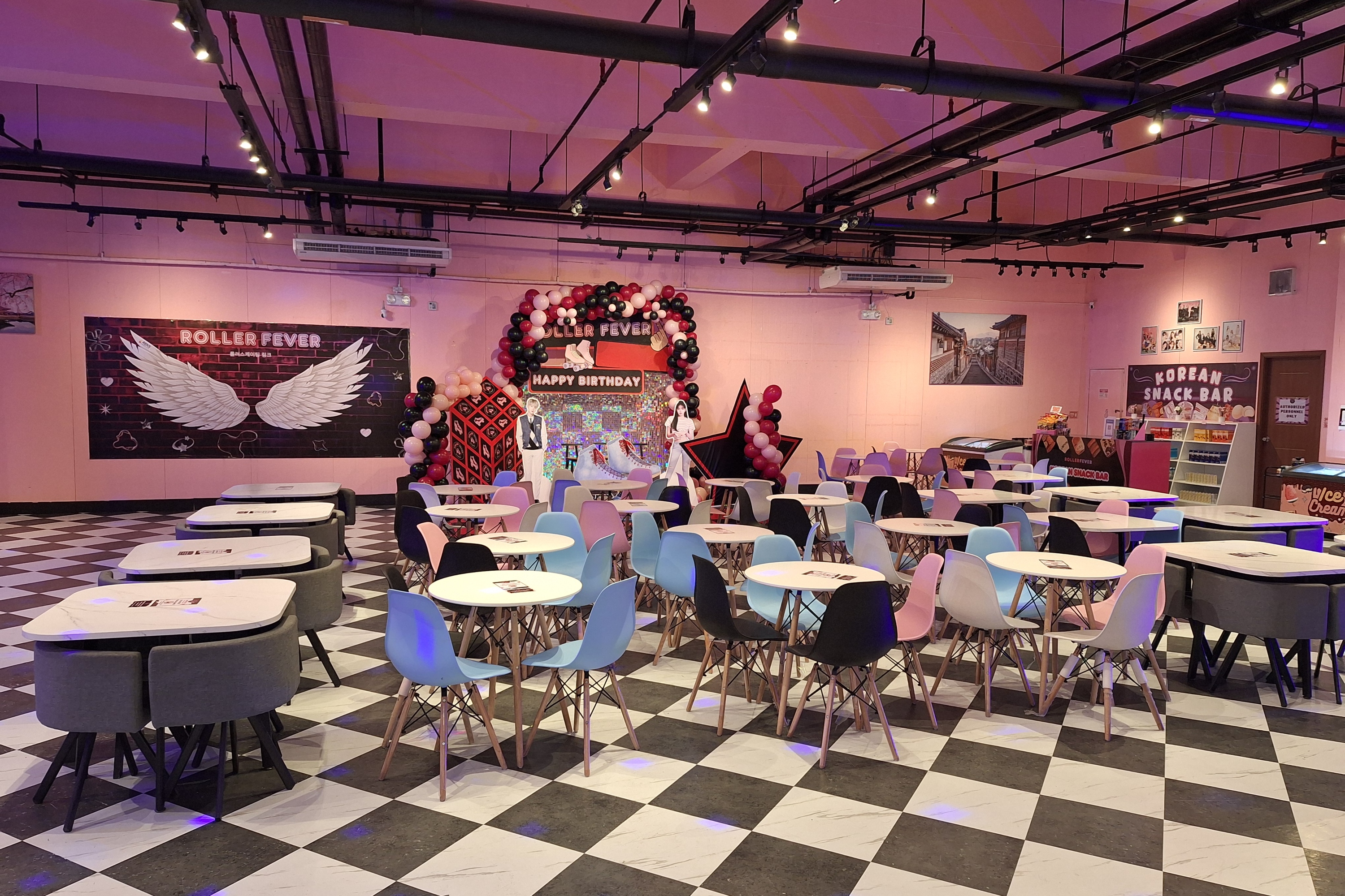 Wide space of function and snack area filled with chairs and tables at Roller Fever Ayala Malls Manila