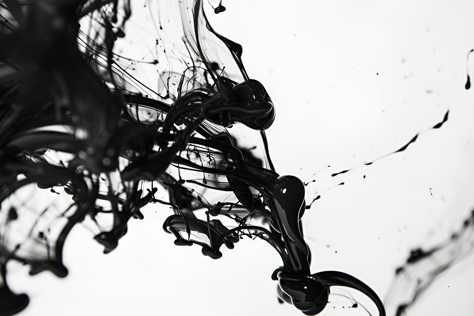 A single drop of black ink falls onto a white Korean  hanji fan — the start of your own handmade story  in Seoul. Korean fan painting class in Hongdae.