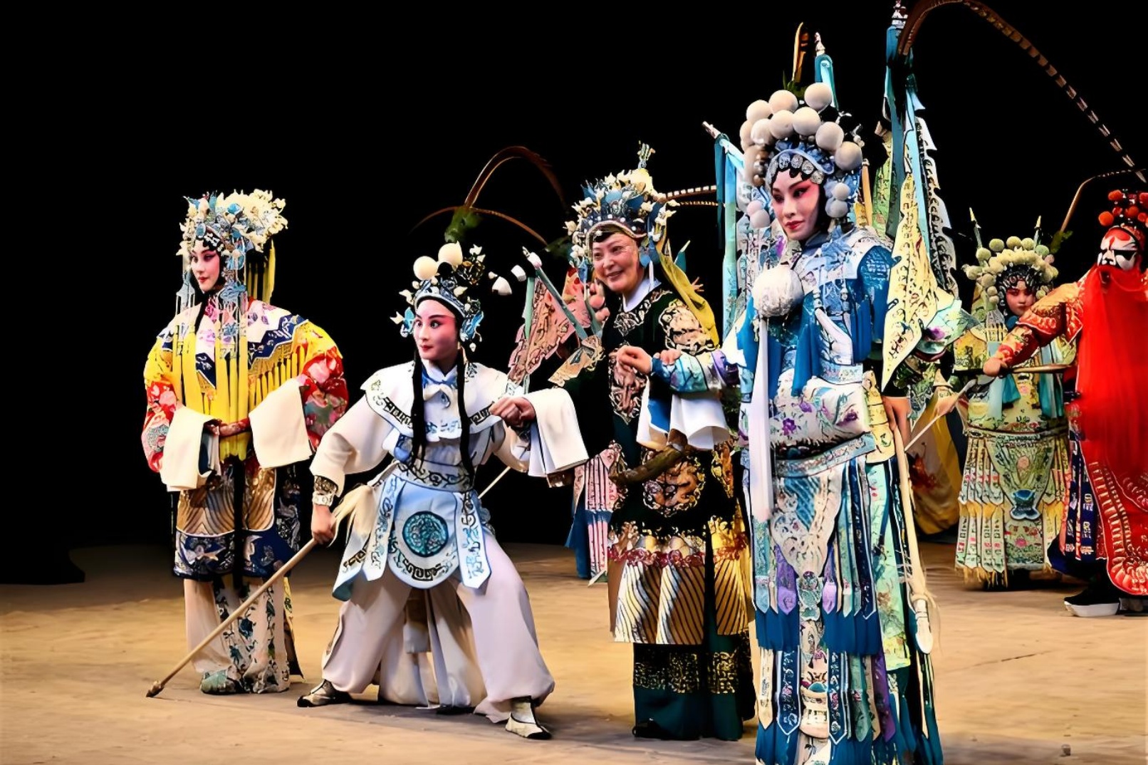 Visit Beijing, watch Peking Opera, eat roast duck, see giant pandas, and taste special food attractions