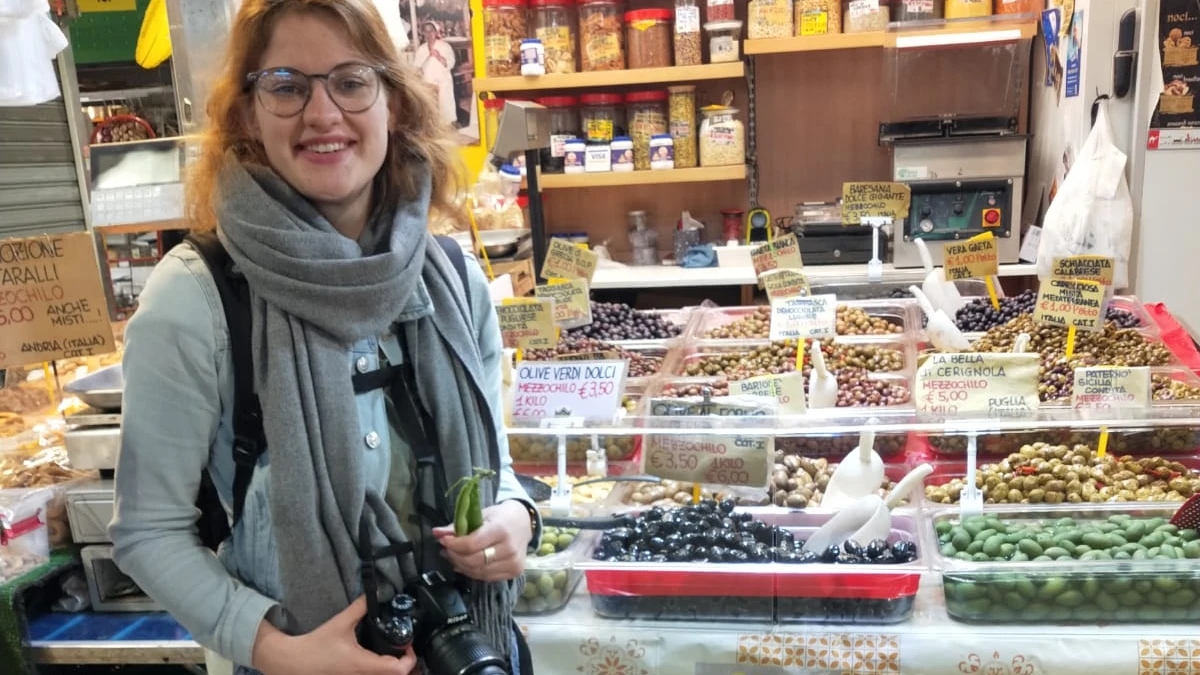 Preserving local food memories with a camera, surrounded by Roman specialties