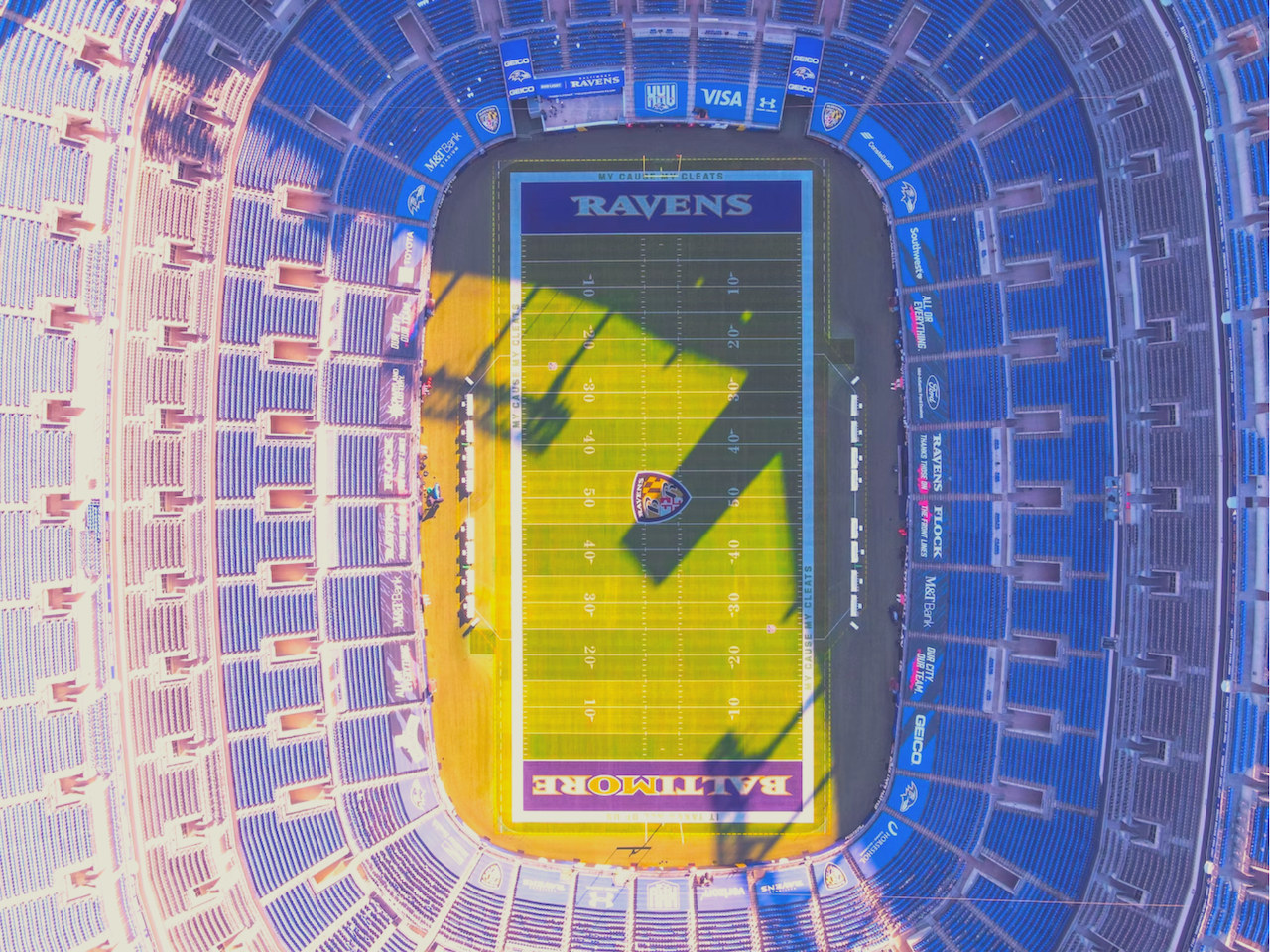 Aerial view of M&T Bank Stadium surrounded by the Baltimore city skyline