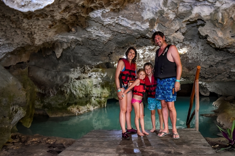 Family enjoying the tour together, exploring Tulum’s history and natural wonders