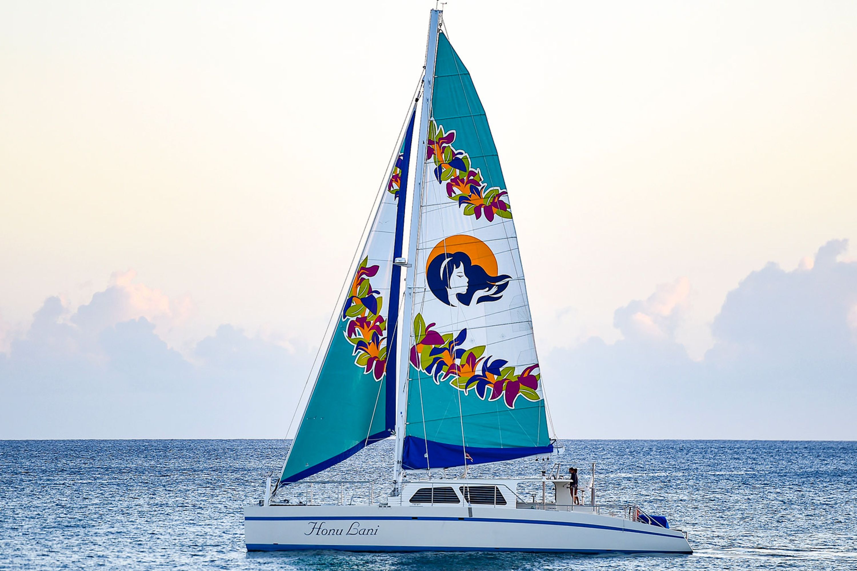 A sleek catamaran is used for the activity, offering stability and comfort while sailing and snorkeling