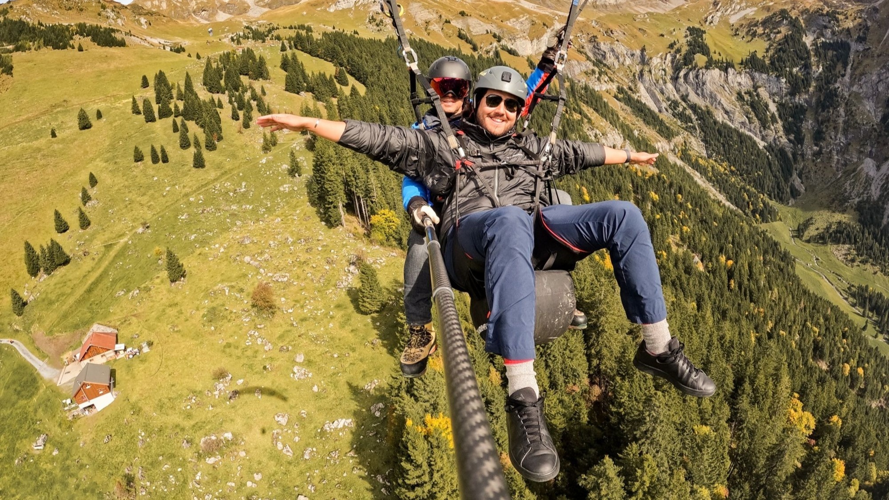 Enjoy panoramic views of mountains and valleys as you glide through the sky in tandem