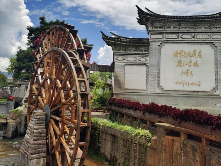 Lijiang Ancient Town is famous for not having city walls. Visit the Naxi architecture featuring small bridges, flowing water and houses.