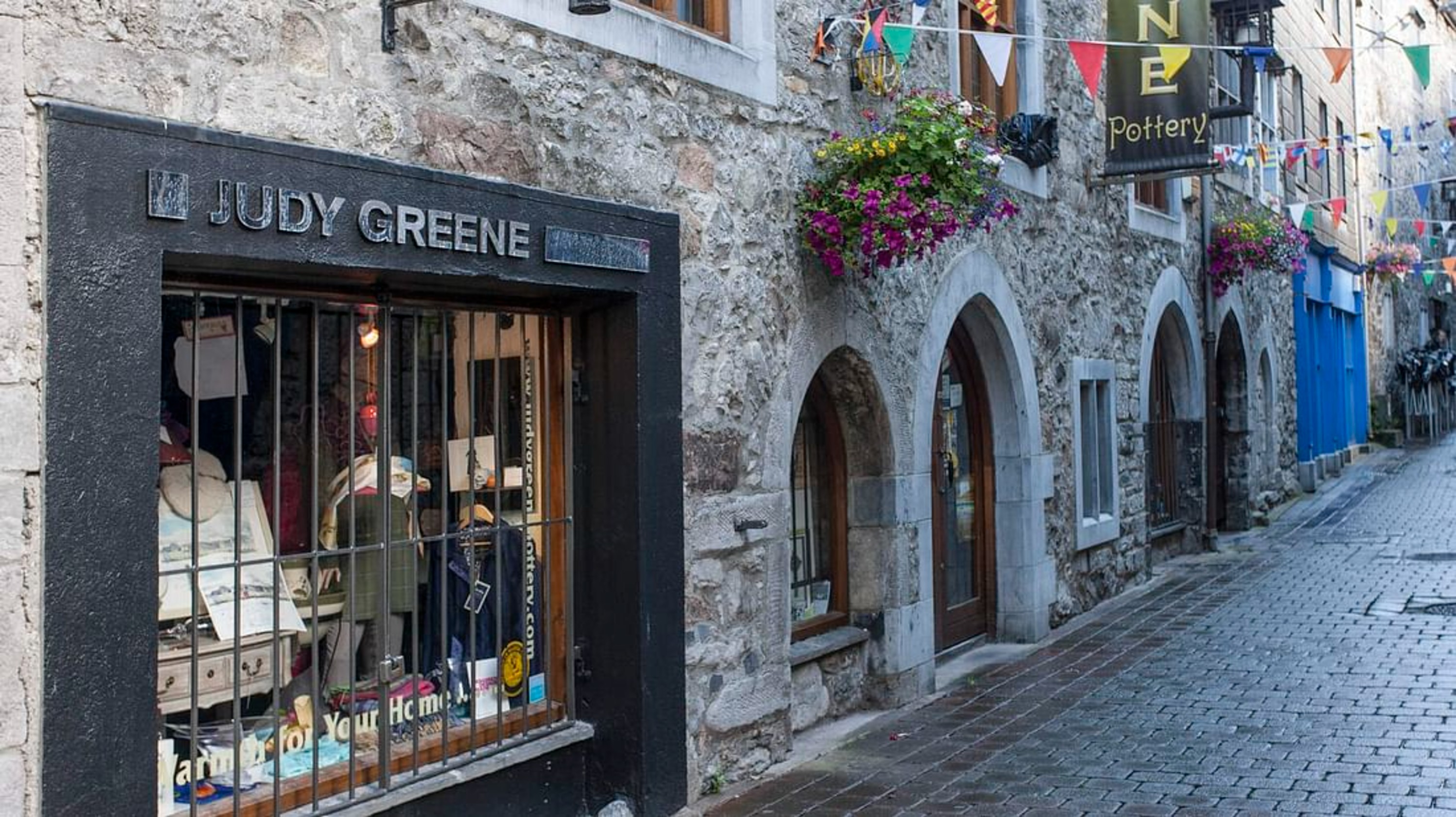Stroll down Galway’s charming cobbled streets, lined with colorful shops and lively pubs