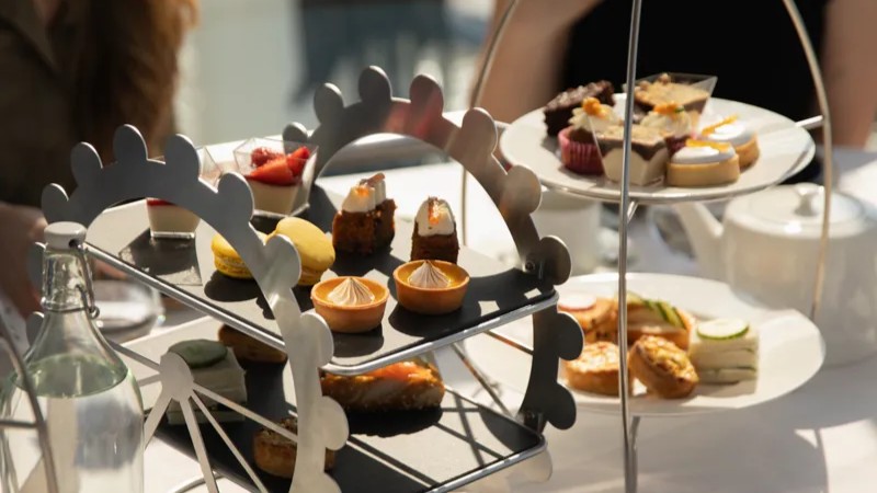 Delight in classic scones and pastries as the London Eye soars above the Thames