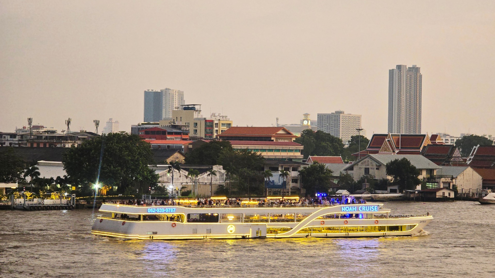 Marvel at the city’s glowing skyline as the cruise sails past iconic landmarks Marvel at the city’s glowing skyline as the cruise sails past iconic landmarks