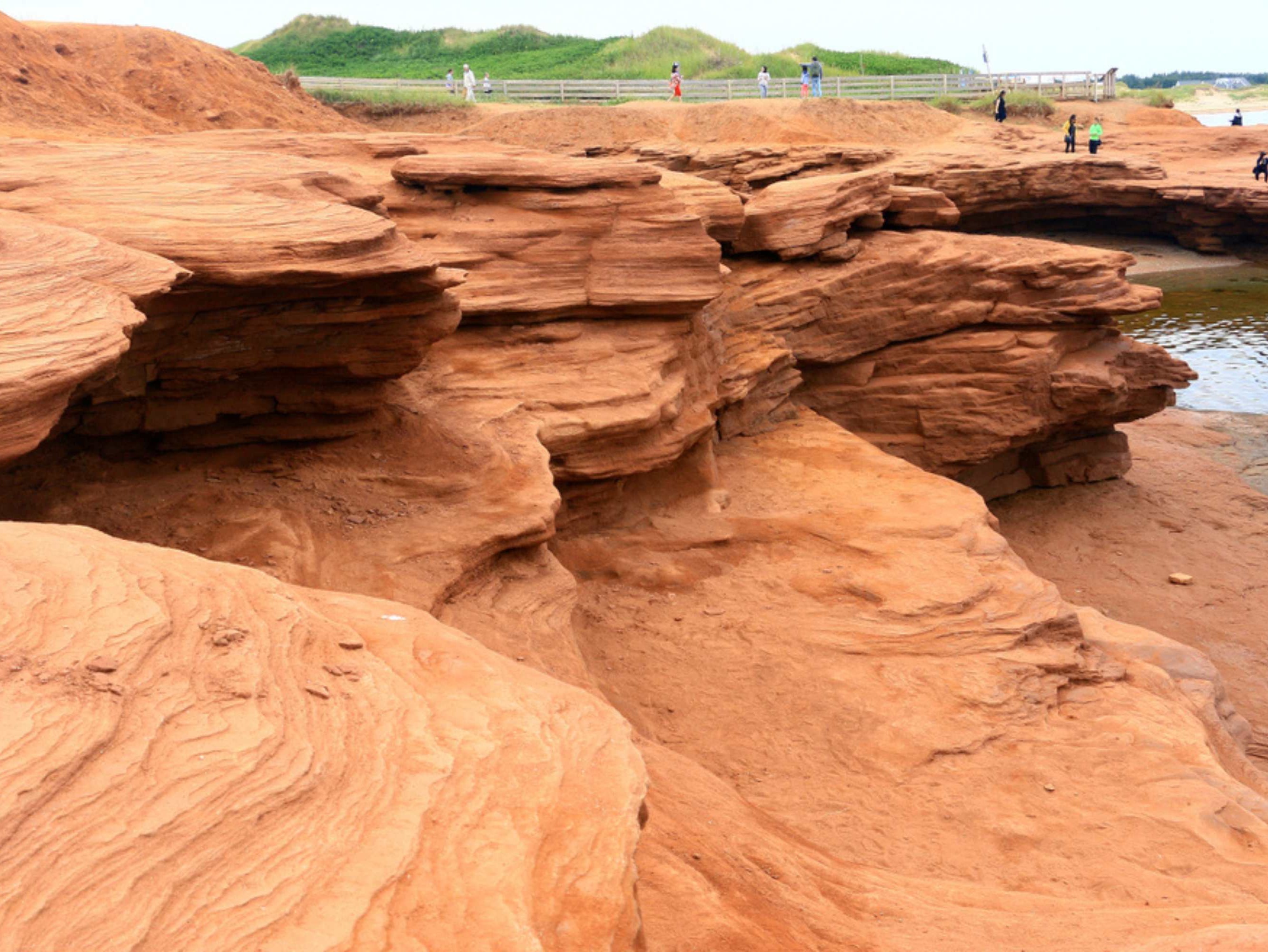 Marvel at the iconic red sandstone cliffs of Cavendish Beach, one of Prince Edward Island’s most breathtaking natural wonders.