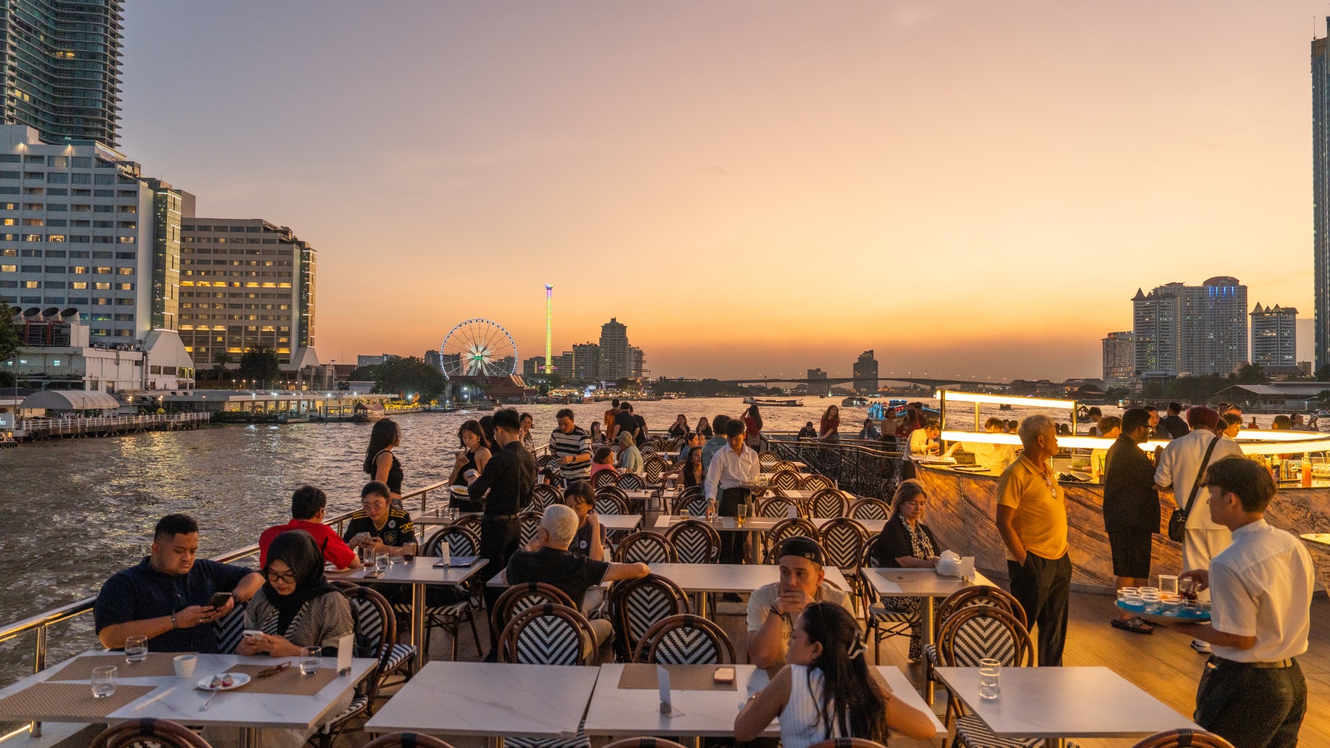 Enjoy a refreshing drink and gourmet snacks while lounging on the spacious open-air deck Enjoy a refreshing drink and gourmet snacks while lounging on the spacious open-air deck