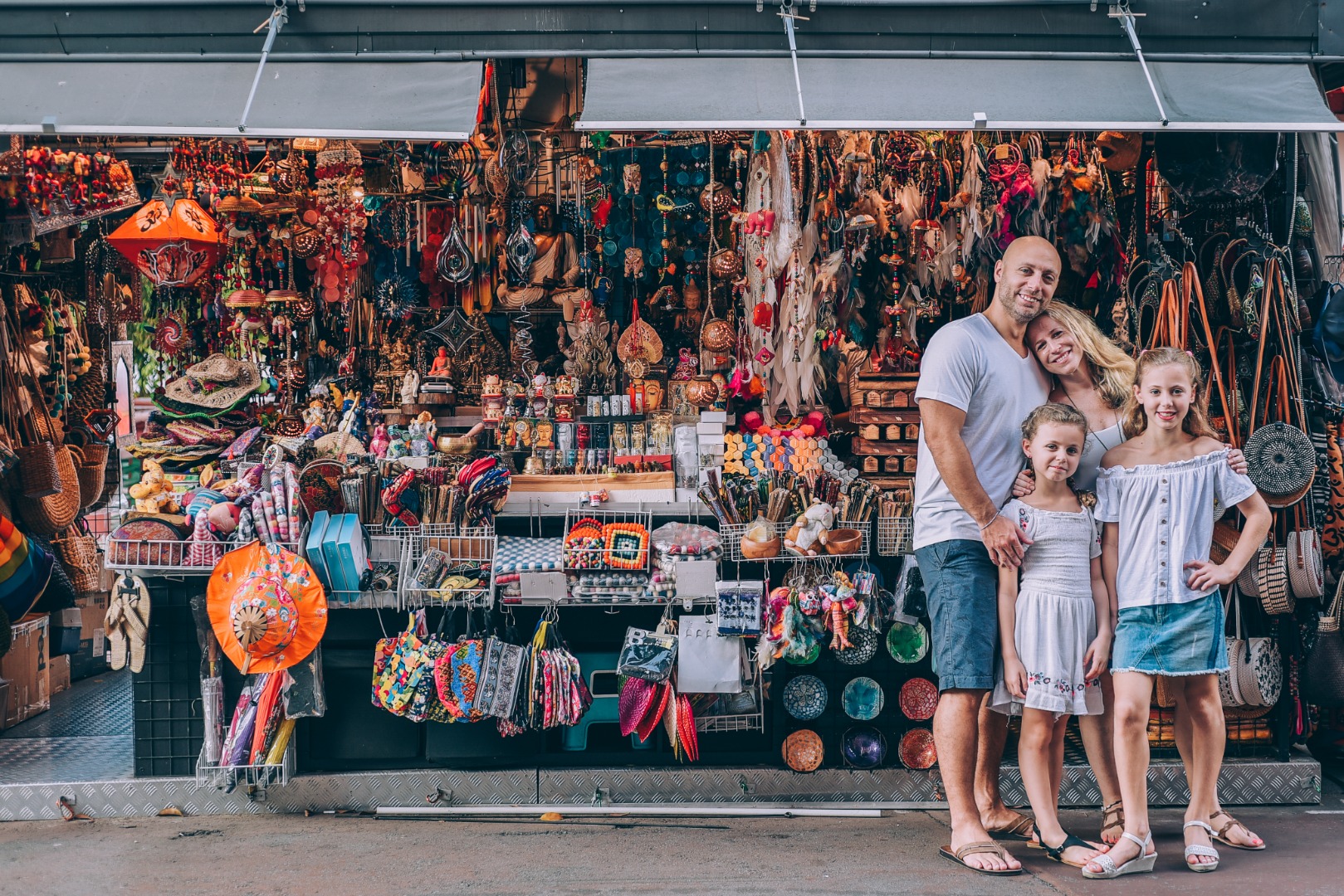 family in front of souvenir shop in Singapore