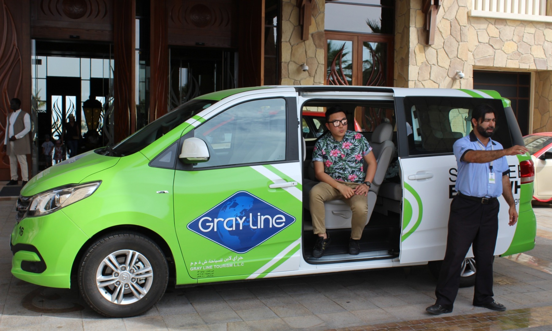 man boarding a car in muscat