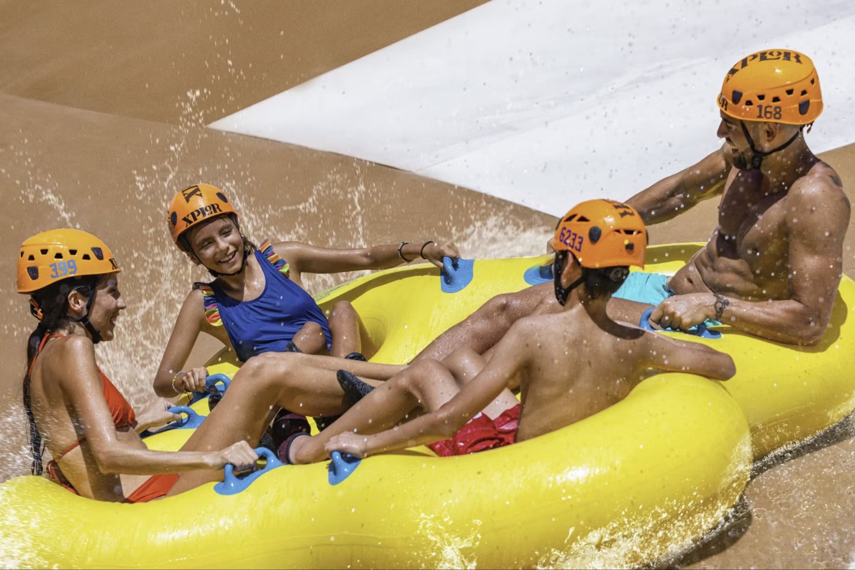 Adventurers paddle through an underground river, surrounded by mystical caves at Xplor Park