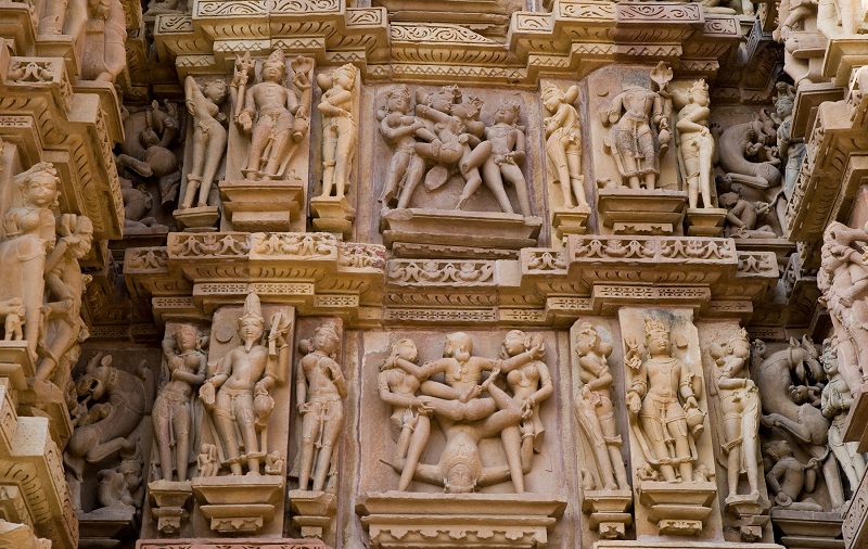 Stone carved erotic bas-relief in Hindu temple in Khajuraho. Unesco World Heritage Site