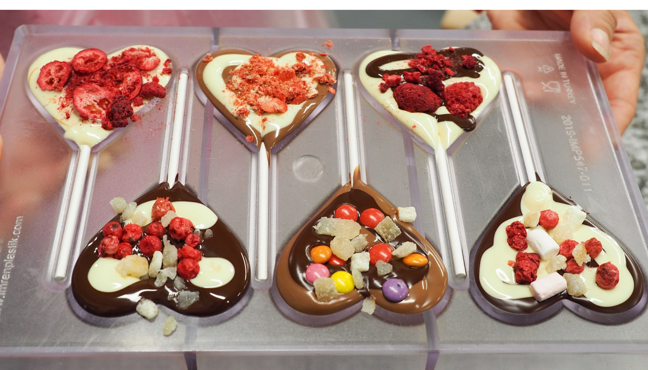 Discover an array of colorful ingredients ready for your chocolate creations.