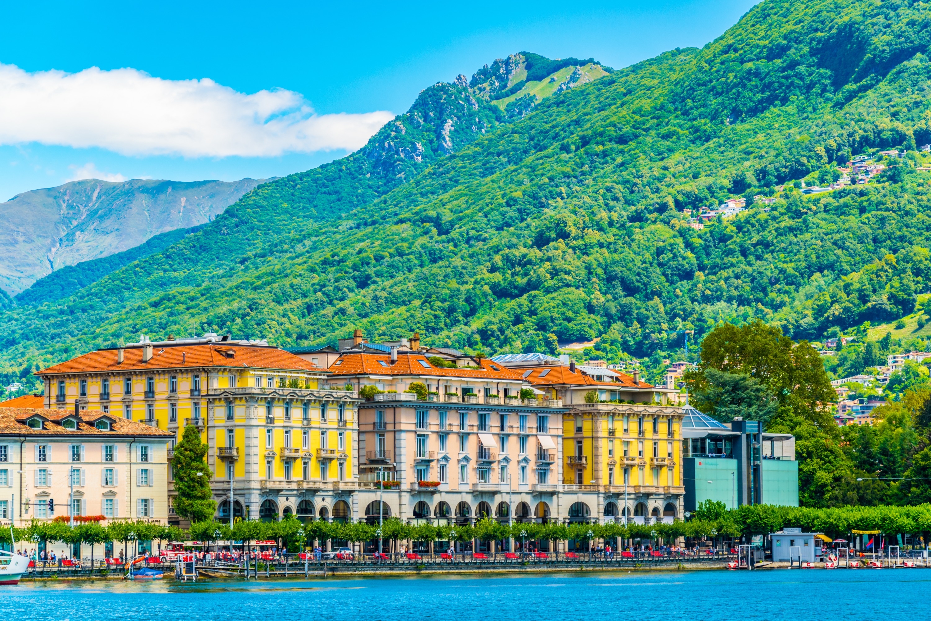 colorful buildings beside Lake Lugano